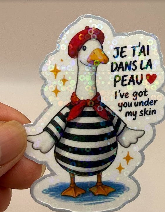 Todo Tumi holographic goose sticker featuring a French-style goose in a red beret and striped shirt with romantic text.