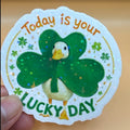 Todo Tumi holographic sticker featuring a cute goose wearing a shamrock with the text Today is your Lucky Day
