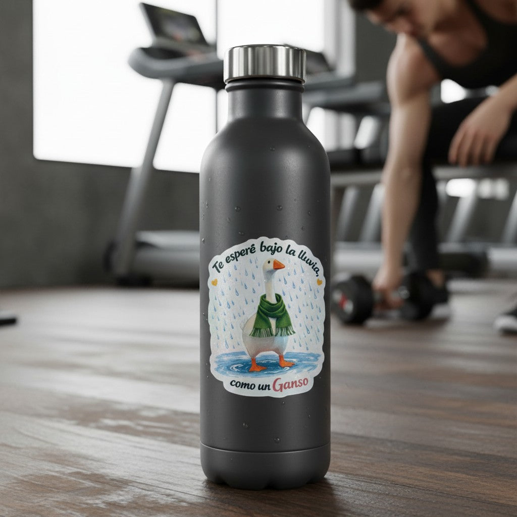 Todo Tumi laminated sticker of a goose in a green scarf standing in the rain on a black water bottle in a gym.