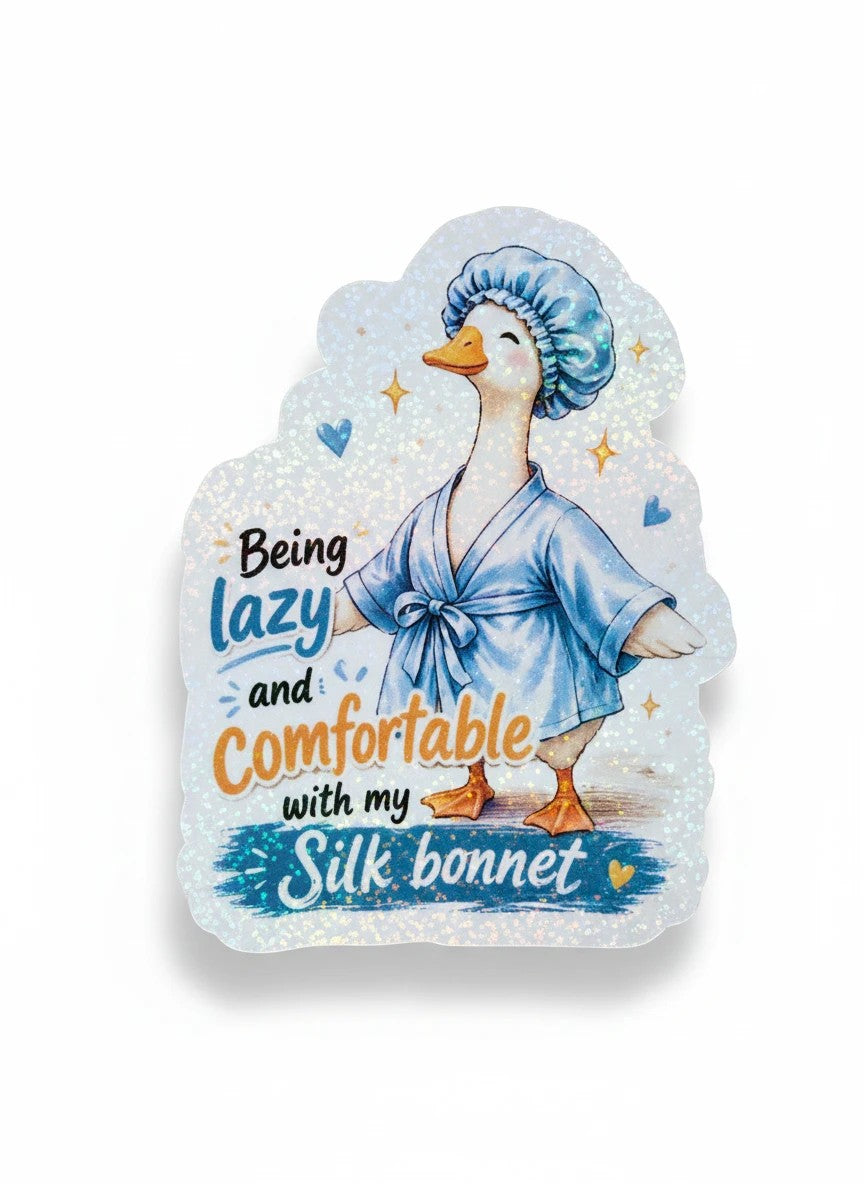 Todo Tumi laminated sticker featuring a hand-drawn goose in a blue robe and silk bonnet with sparkly holographic finish