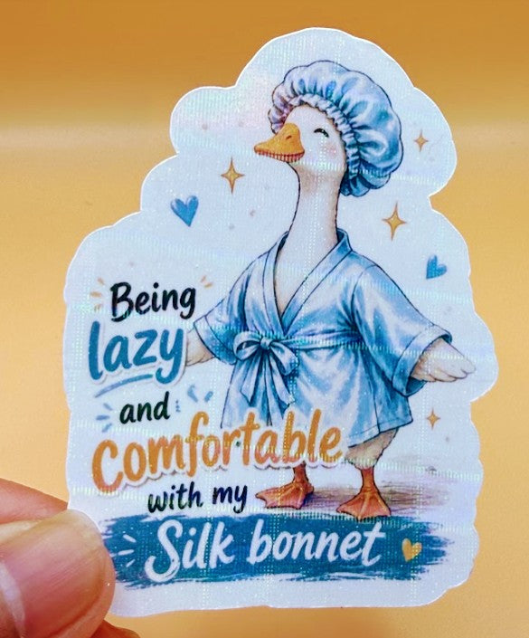 Todo Tumi laminated sticker featuring a hand-drawn goose in a blue robe and silk bonnet with funny text.