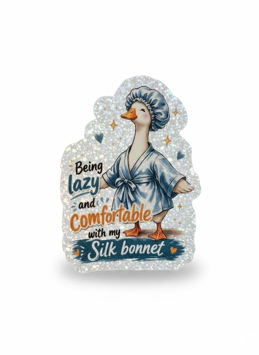 Todo Tumi holographic vinyl sticker featuring a cute duck in a blue robe and silk bonnet with whimsical star accents.
