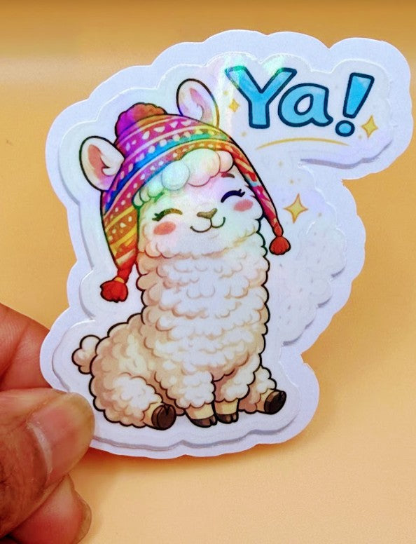 Todo Tumi Ya! llama sticker featuring a cute llama in a colorful chullo hat with a holographic finish.