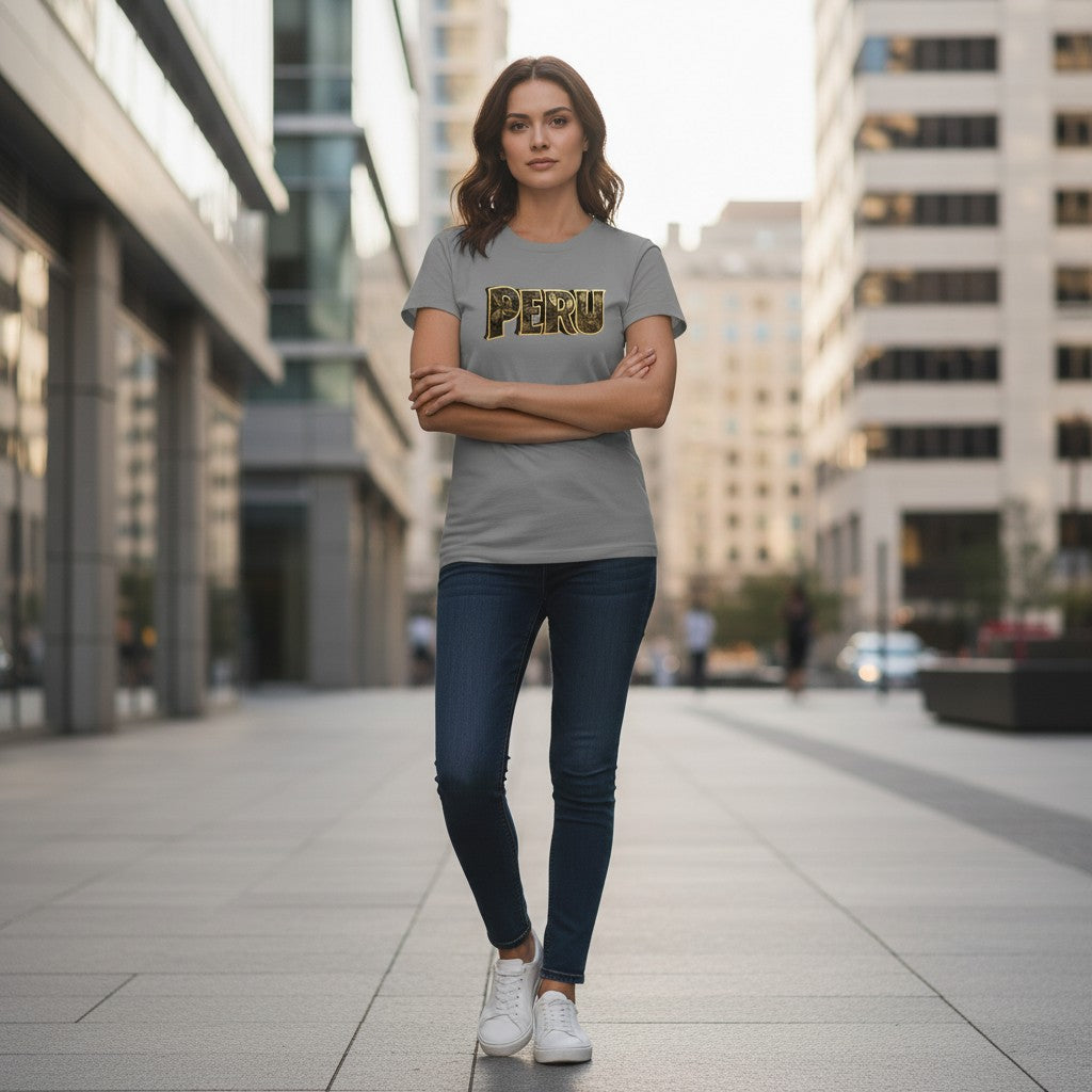 Model wearing a gray Todo Tumi cotton t-shirt with gold PERU Nazca Lines graphic in a city street setting.