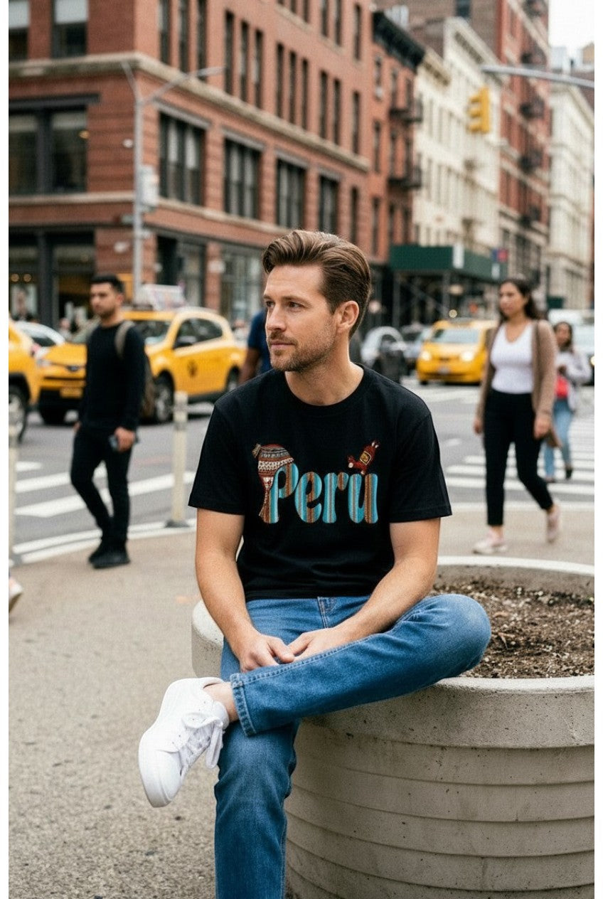 Man wearing a black Todo Tumi Perú Textile Chullo cotton t-shirt with Andean-inspired graphic on a city street.