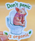 Todo Tumi holographic sticker featuring a cute pig on a toilet with the text Don't panic, it's organic.