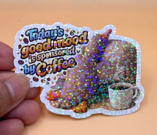 Todo Tumi holographic Teddy Duck sticker featuring a duck with a coffee cup and text about coffee-sponsored moods.